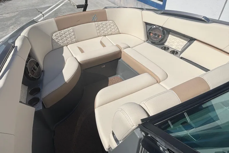 Slide: The Image of Luxurious interior of 2022 MasterCraft X26 boat with beige seating and cup holders. - 7