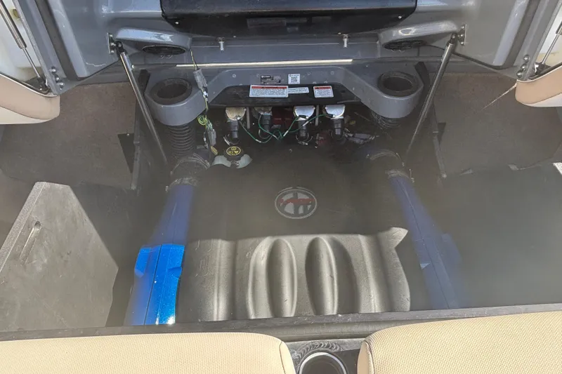 Slide: The Image of Engine compartment of a 2022 MasterCraft X26 boat, showcasing internal components and layout. - 9