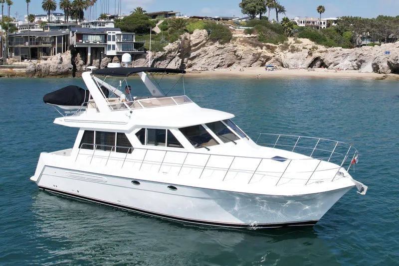 Slide: The Image of 2007 Navigator 44 Classic yacht cruising near a scenic rocky coastline. - 1