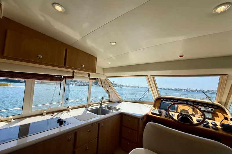 Slide: The Image of Interior view of 2007 Navigator 44 Classic yacht helm with panoramic windows and modern controls. - 12