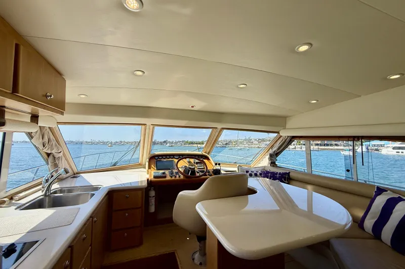 Slide: The Image of Interior of 2007 Navigator 44 Classic yacht with helm, seating, and ocean view. - 13
