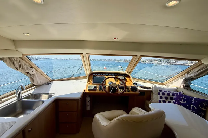 Slide: The Image of Luxurious interior of 2007 Navigator 44 Classic yacht with helm, sink, and scenic ocean view. - 14
