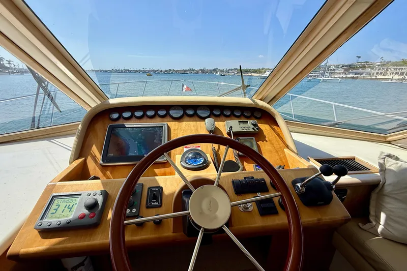 Slide: The Image of Helm of 2007 Navigator 44 Classic yacht with navigation instruments and scenic ocean view. - 17