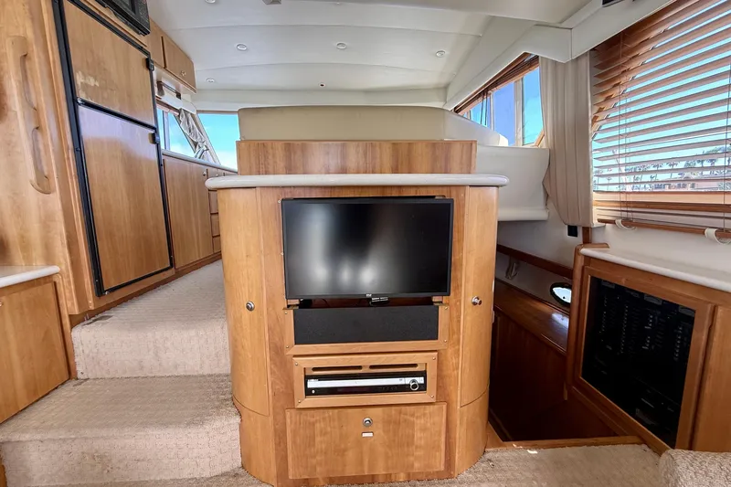Slide: The Image of Interior of 2007 Navigator 44 Classic yacht with wood paneling and entertainment center. - 20