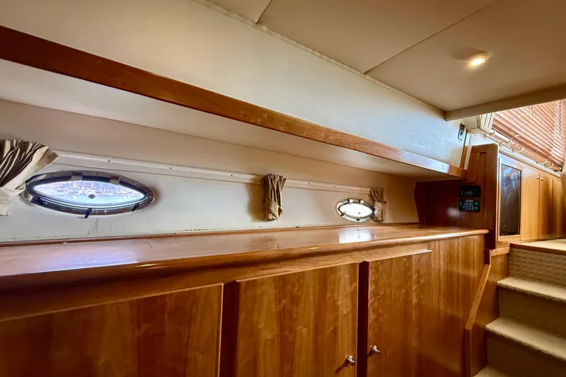 Slide: The Image of Interior of 2007 Navigator 44 Classic yacht with wooden cabinetry and porthole windows. - 22