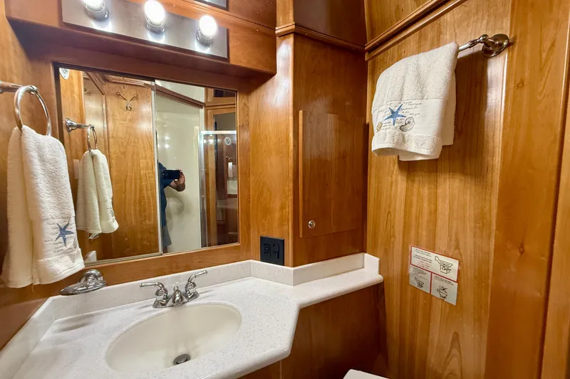 Slide: The Image of Luxurious wooden bathroom interior of 2007 Navigator 44 Classic yacht with elegant fixtures. - 26