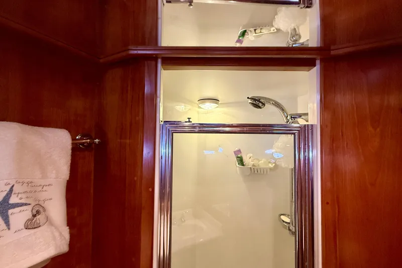 Slide: The Image of Luxurious bathroom in 2007 Navigator 44 Classic yacht with wooden accents and shower. - 27