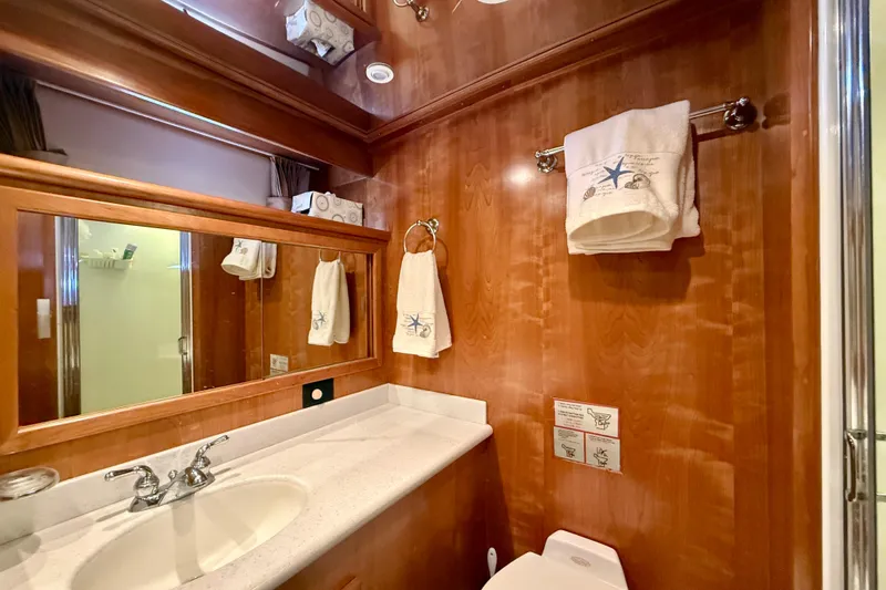 Slide: The Image of Luxurious bathroom in 2007 Navigator 44 Classic yacht with wood paneling and elegant fixtures. - 28