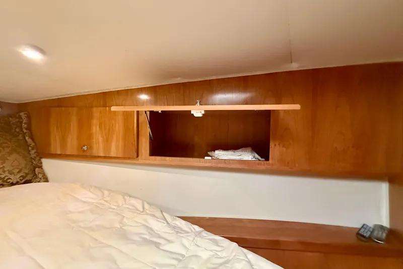 Slide: The Image of Wooden cabin interior with storage compartments in a 2007 Navigator 44 Classic yacht. - 31