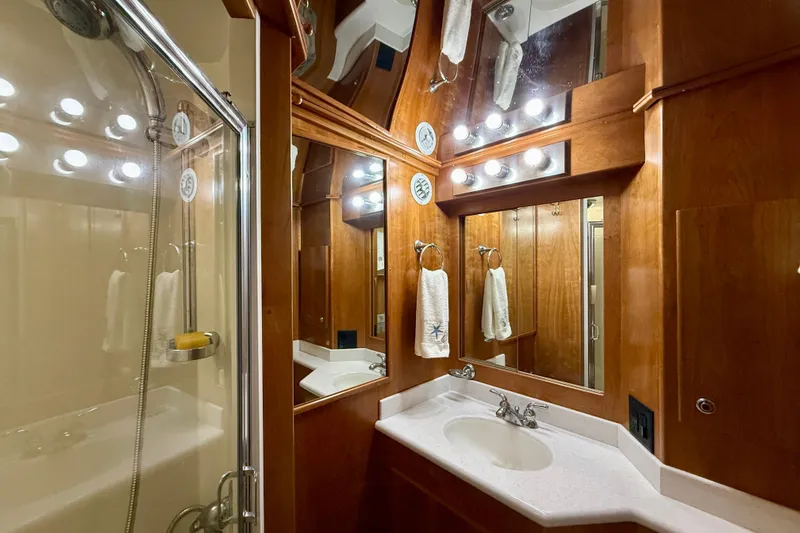 Slide: The Image of Luxurious bathroom in 2007 Navigator 44 Classic yacht with wood accents and modern fixtures. - 32