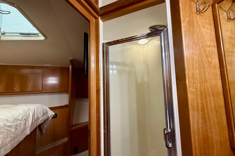 Slide: The Image of Interior of 2007 Navigator 44 Classic yacht featuring a cozy cabin and shower area. - 33