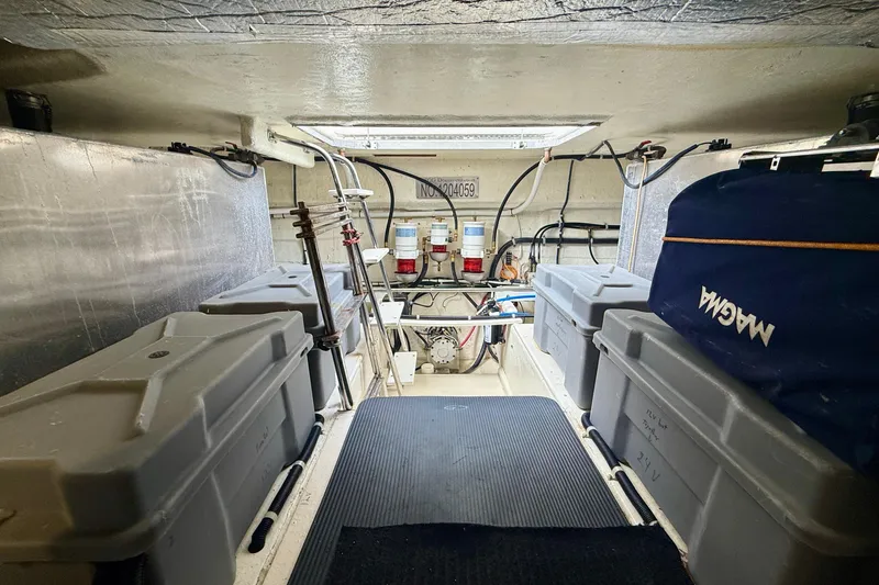 Slide: The Image of Engine room of 2007 Navigator 44 Classic yacht with storage containers and equipment. - 34