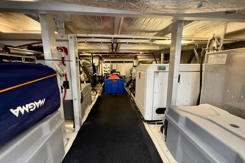 Slide: The Image of Engine room of 2007 Navigator 44 Classic yacht, featuring equipment and storage. - 35