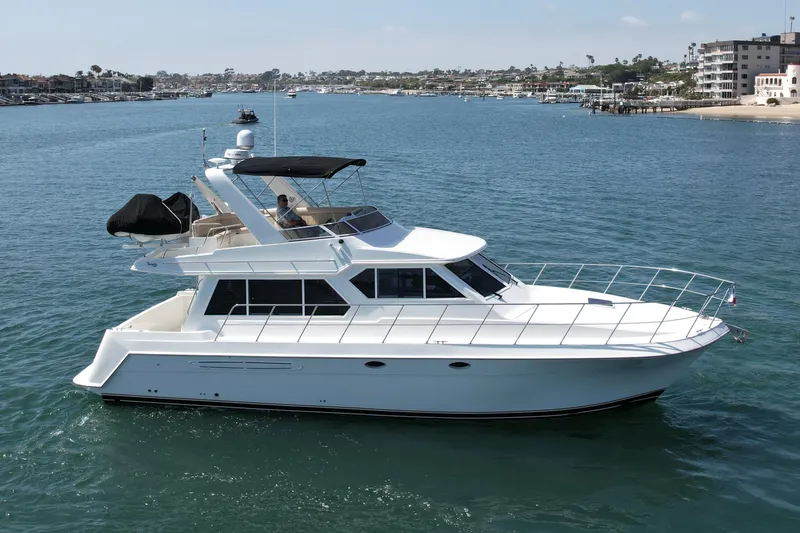 Slide: The Image of 2007 Navigator 44 Classic yacht cruising in a scenic coastal area. - 4