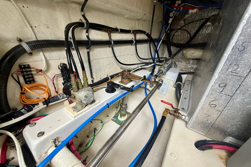 Slide: The Image of Engine room of 2007 Navigator 44 Classic yacht, showcasing intricate wiring and mechanical components. - 44
