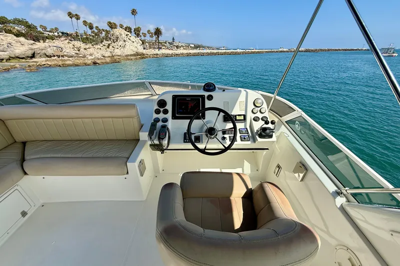 Slide: The Image of Helm of 2007 Navigator 44 Classic yacht with ocean view and coastal scenery. - 49