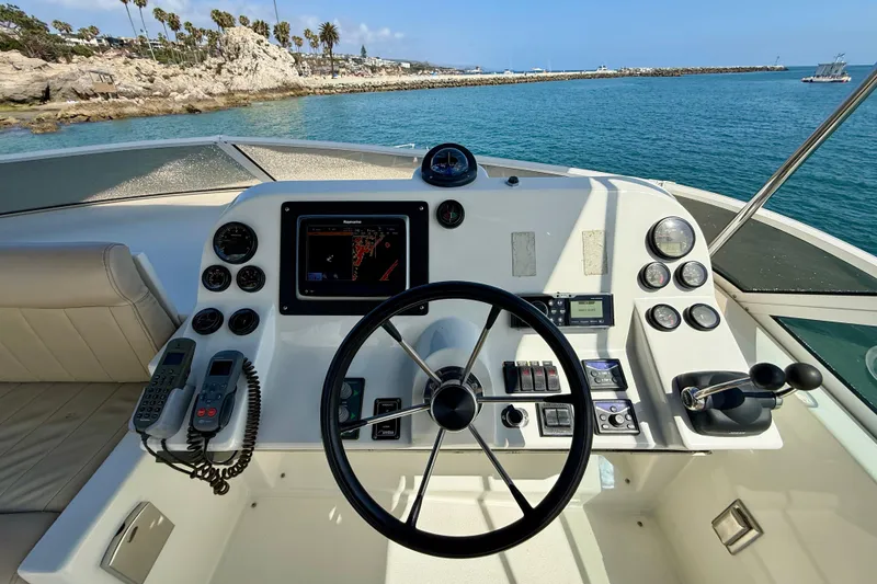 Slide: The Image of Helm of 2007 Navigator 44 Classic yacht with navigation equipment and ocean view. - 50