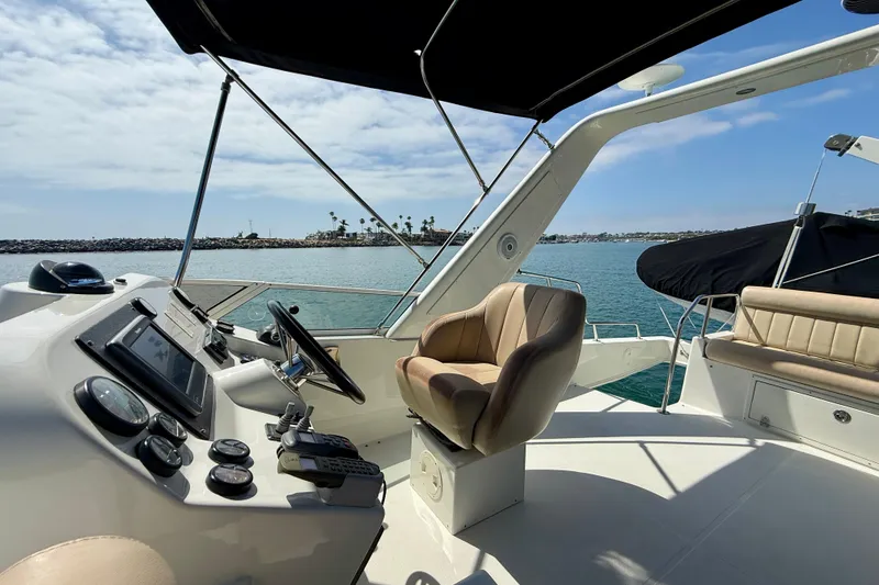 Slide: The Image of Cockpit view of 2007 Navigator 44 Classic yacht with ocean backdrop. - 53