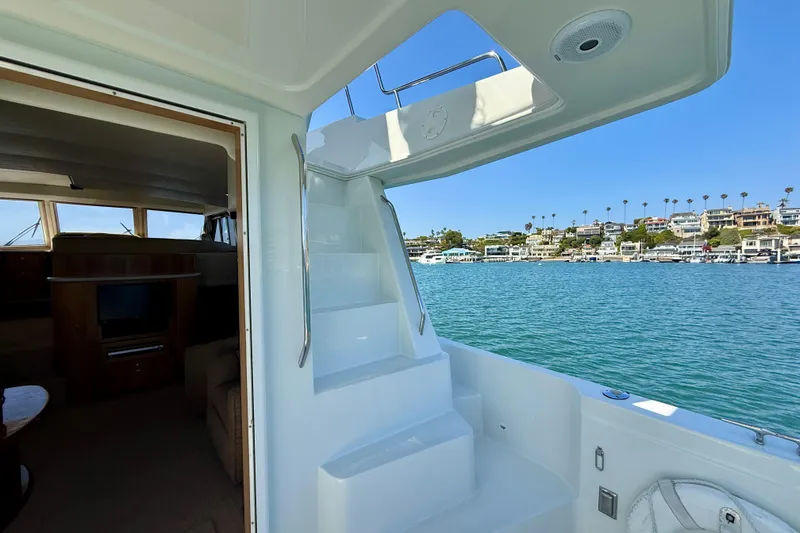 Slide: The Image of 2007 Navigator 44 Classic yacht interior with ocean view and coastal homes. - 56