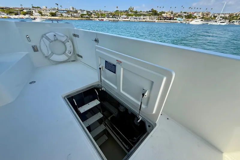 Slide: The Image of 2007 Navigator 44 Classic yacht deck with open hatch and scenic waterfront view. - 58