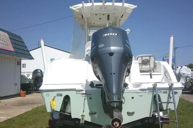 Slide: The Image of 2019 Sea Fox 248 Commander boat with powerful 300 HP engine, displayed outdoors. - 10