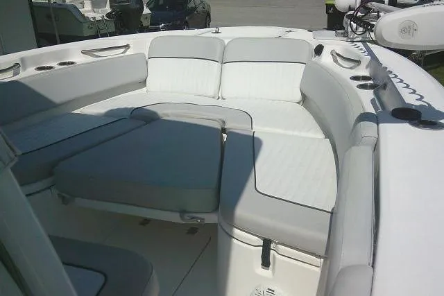 Slide: The Image of 2019 Sea Fox 248 Commander boat interior with cushioned seating and cup holders. - 17