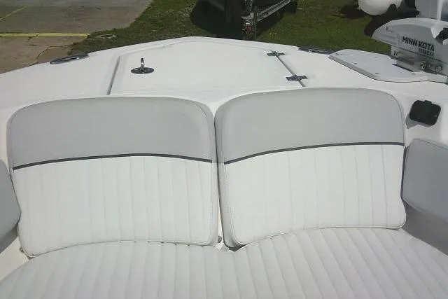 Slide: The Image of 2019 Sea Fox 248 Commander boat with white cushioned seating and deck view. - 21