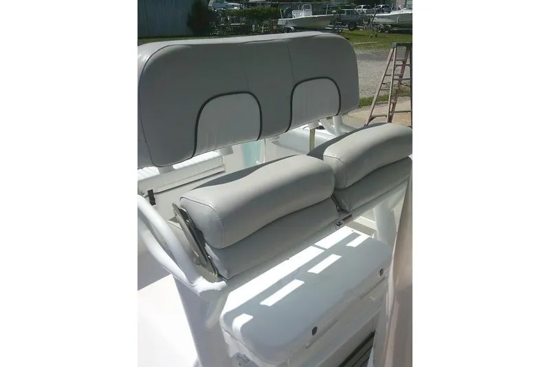 Slide: The Image of 2019 Sea Fox 248 Commander boat seating with cushioned backrest and armrests. - 31