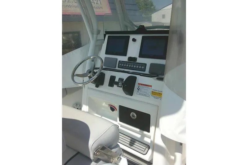 Slide: The Image of Helm of 2019 Sea Fox 248 Commander with dual screens and steering wheel. - 34