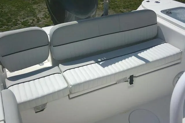 Slide: The Image of 2019 Sea Fox 248 Commander boat seating area with white cushioned seats. - 46