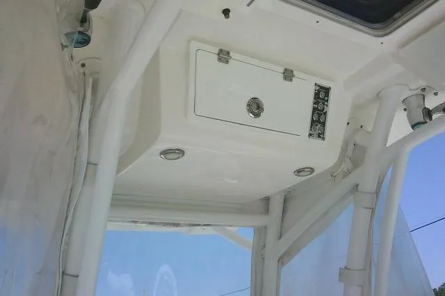 Slide: The Image of 2019 Sea Fox 248 Commander boat interior with control panel and storage compartment. - 59