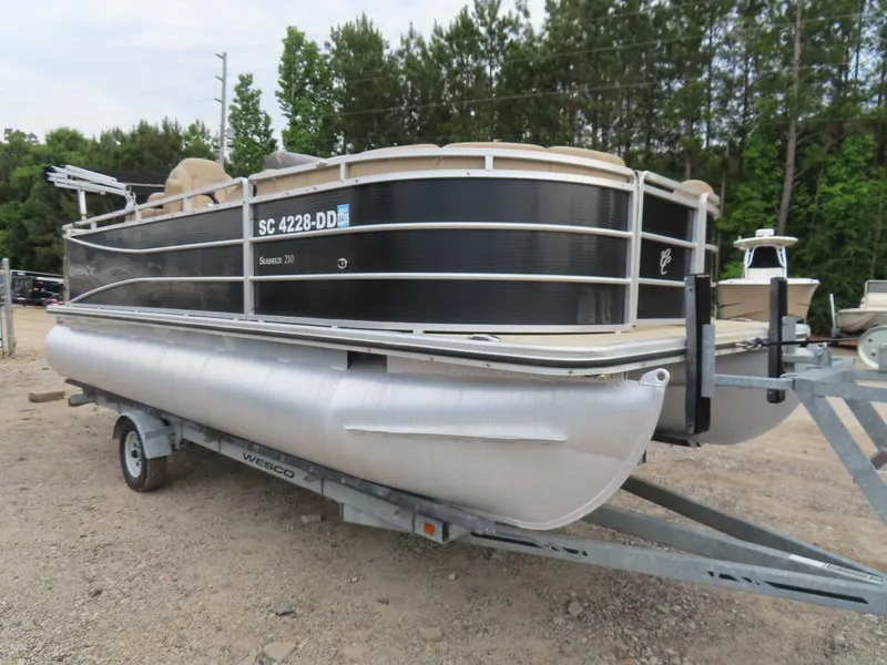 The Image of 2016 Cypress Cay SeaBreeze 210 Pontoon on trailer parked outdoors. - 1