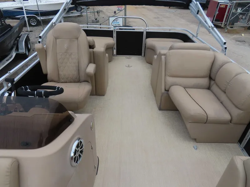 Slide: The Image of Interior of a 2016 Cypress Cay SeaBreeze 210 pontoon boat with beige seating. - 15