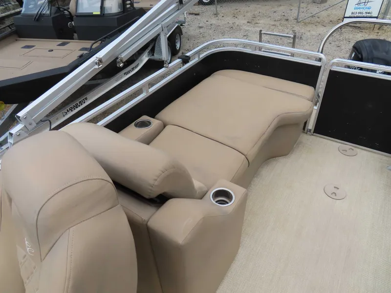 Slide: The Image of Interior of a 2016 Cypress Cay SeaBreeze 210 pontoon boat with beige seating. - 22
