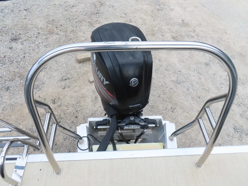 Slide: The Image of 2016 Cypress Cay SeaBreeze 210 Pontoon with outboard motor. - 24