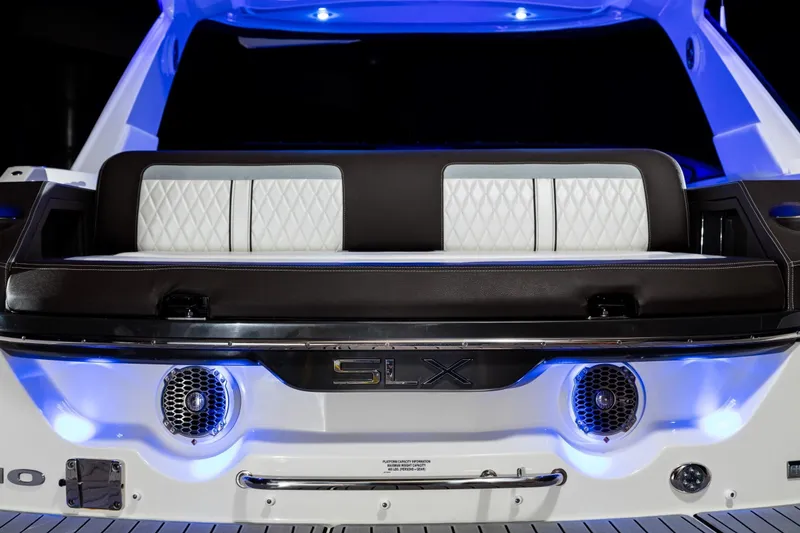 Slide: The Image of Rear view of 2016 Sea Ray SLX 310 yacht with illuminated seating area. - 15