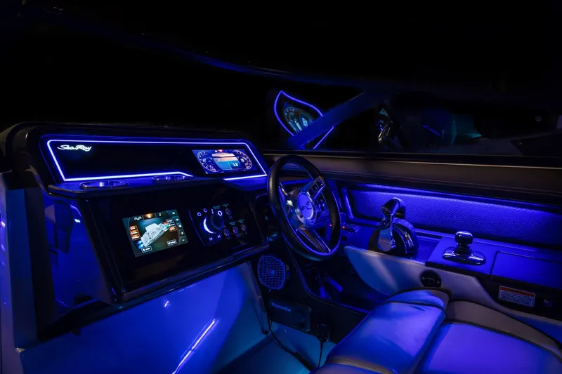 Slide: The Image of Illuminated cockpit of a 2016 Sea Ray SLX 310 boat at night. - 19