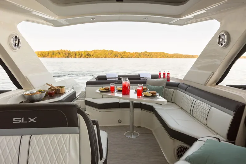 Slide: The Image of Interior of a Sea Ray SLX 310 yacht with set dining table. - 28