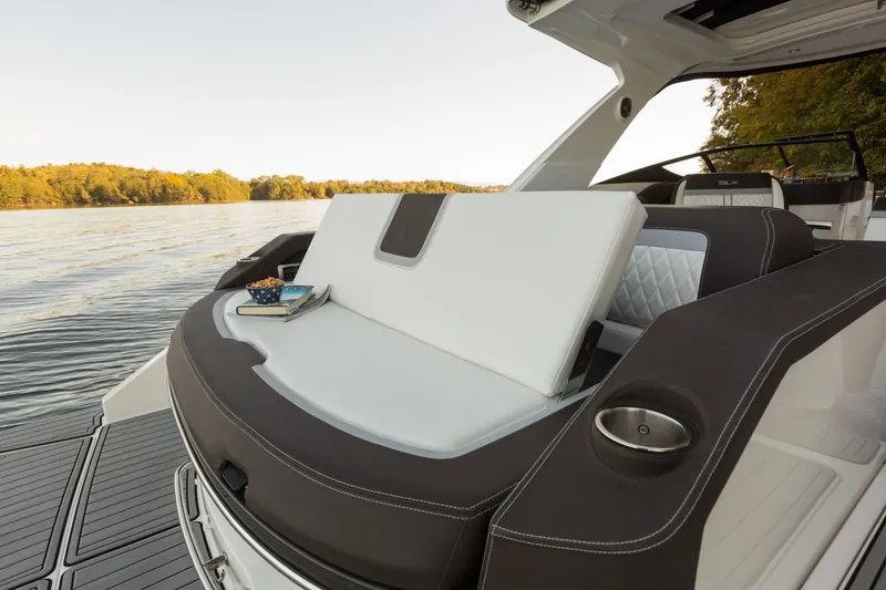 Slide: The Image of 2016 Sea Ray SLX 310 boat with luxurious seating area by the lake. - 39