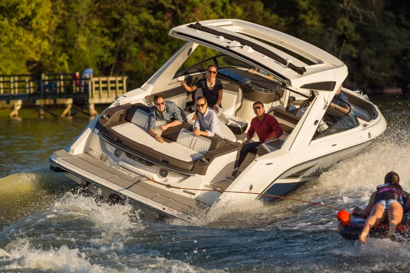 Slide: The Image of 2016 Sea Ray SLX 310 boat towing water sports enthusiast. - 7