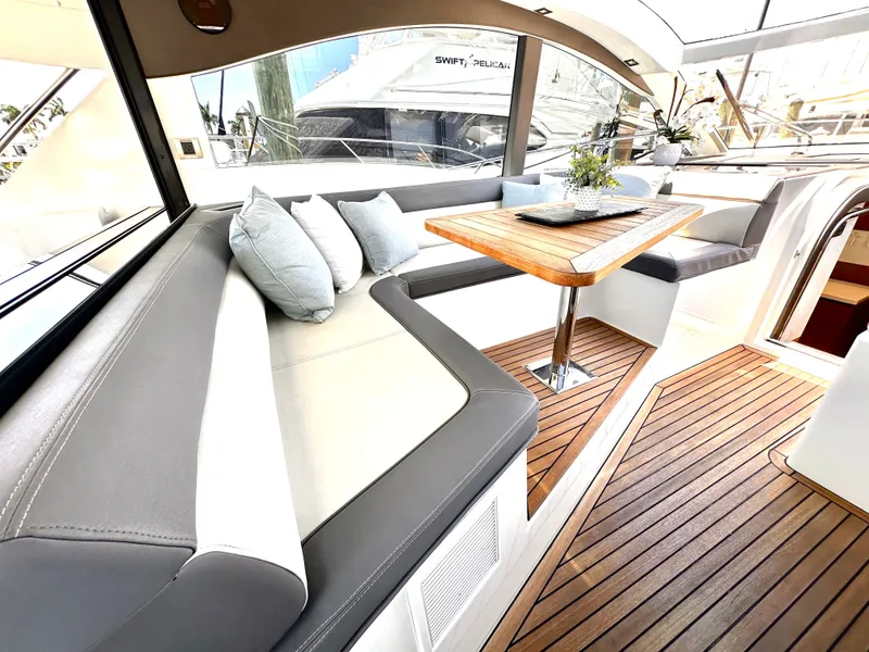 Slide: The Image of Interior of 2019 Galeon 485 HTS yacht with elegant seating area. - 16