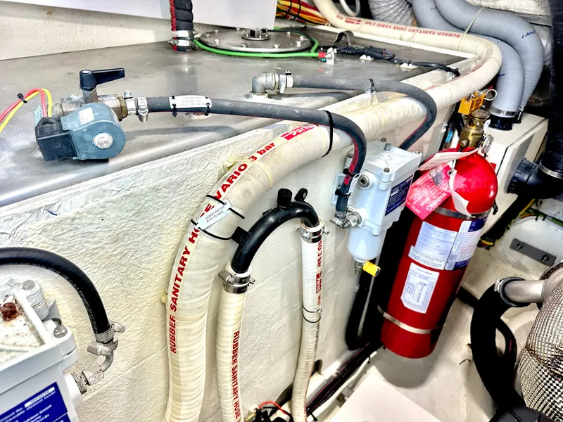 Slide: The Image of Engine room of 2019 Galeon 485 HTS with hoses and fire extinguisher. - 48