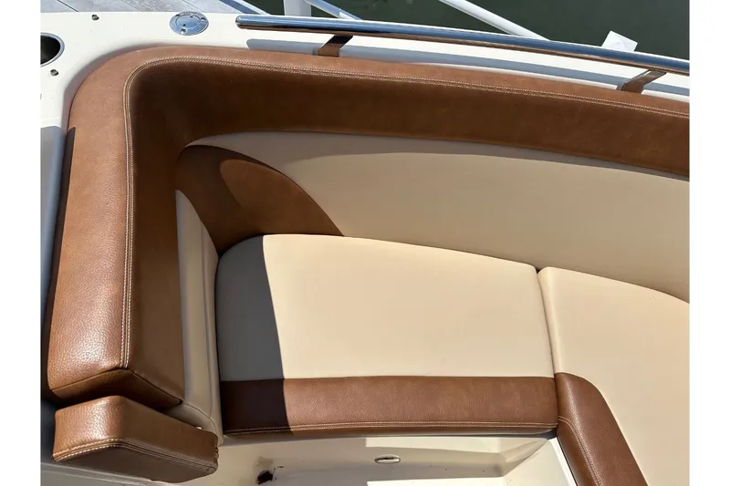 Slide: The Image of Close-up of brown and cream upholstery in the bow area of a boat. - 31