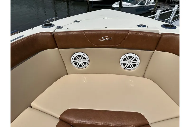 Slide: The Image of The 2021 Scout 235 Dorado features cushioned seating with speakers in the bow area. - 30