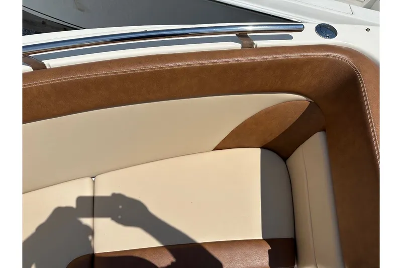 Slide: The Image of Close-up of boat seating upholstery with brown and cream leather accents. - 32