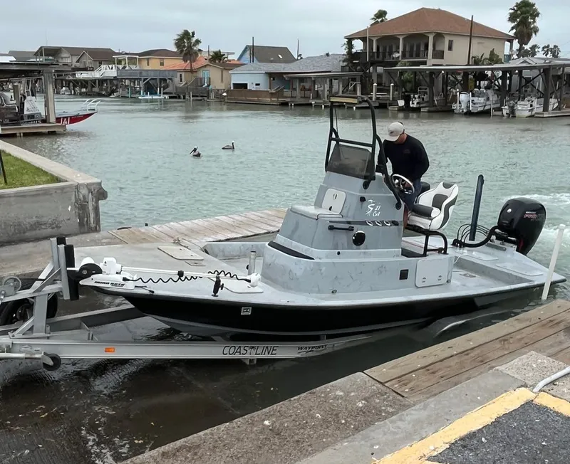 The Image of Shoalwater 21' Catamaran 2021 at dock with trailer. - 0