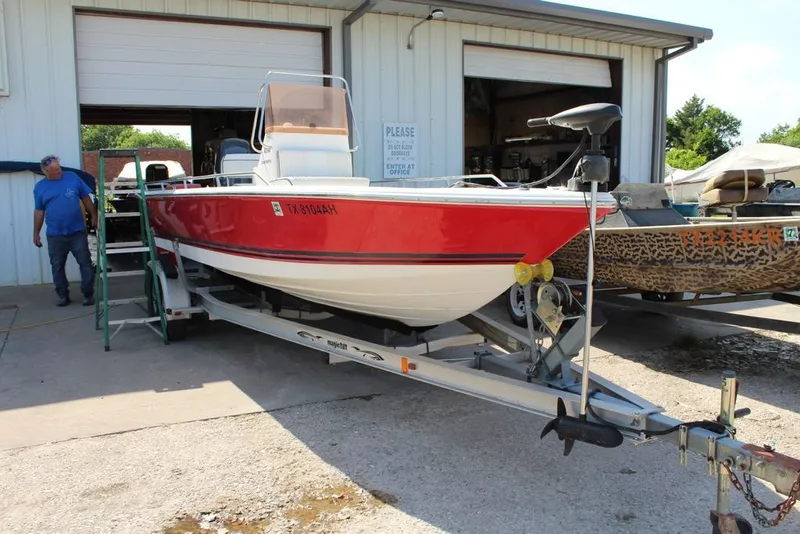 Slide: The Image of 2006 Clearwater 21CC boat on trailer outside workshop. - 1