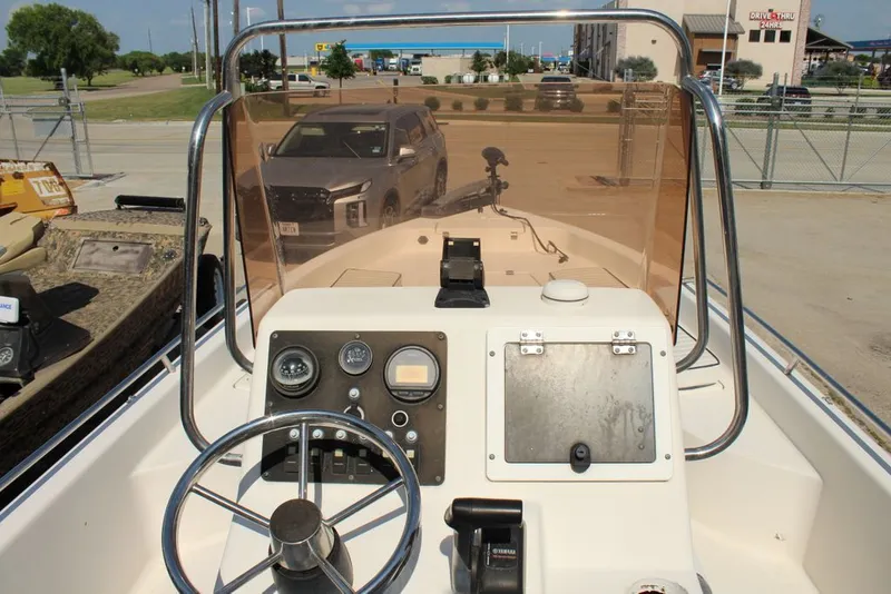 Slide: The Image of 2006 Clearwater 21CC boat console with steering and instruments. - 3