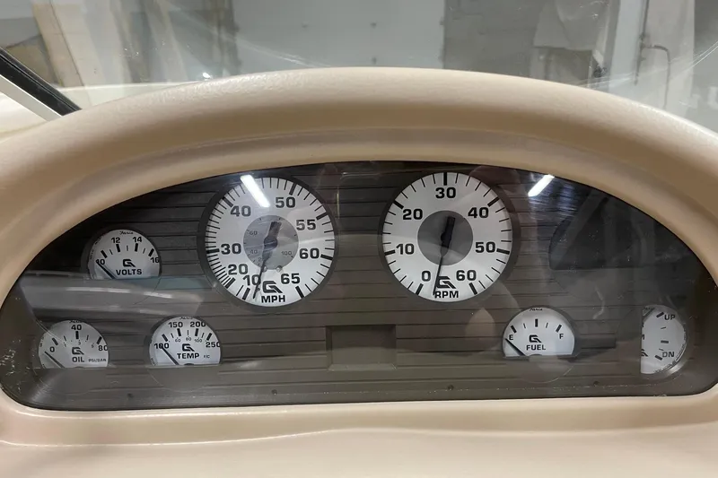 Slide: The Image of Dashboard of a 1995 Glastron SSV 175 boat with various gauges. - 11