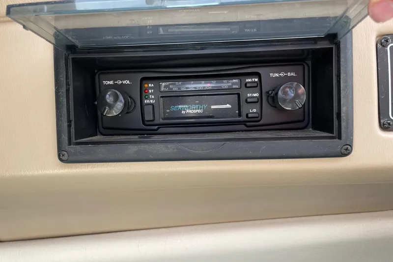 Slide: The Image of 1995 Glastron SSV 175 boat stereo system with tone and volume controls. - 12